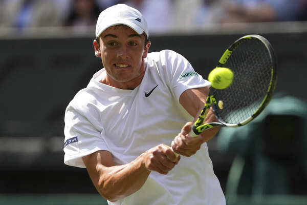 Oliver Tarvet celebrates a first-round victory at Wimbledon.
